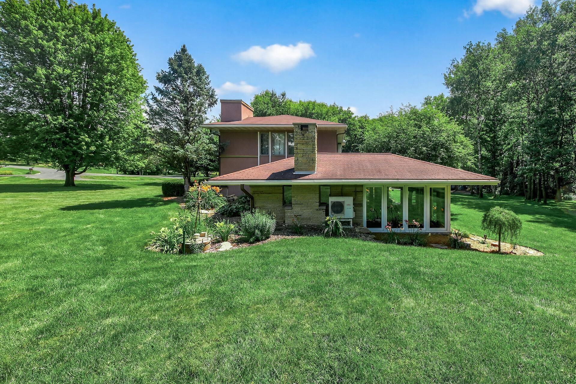 Backside of home butts up to 2 acres of land.