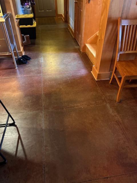 Heated colored concrete flooring on the main level.