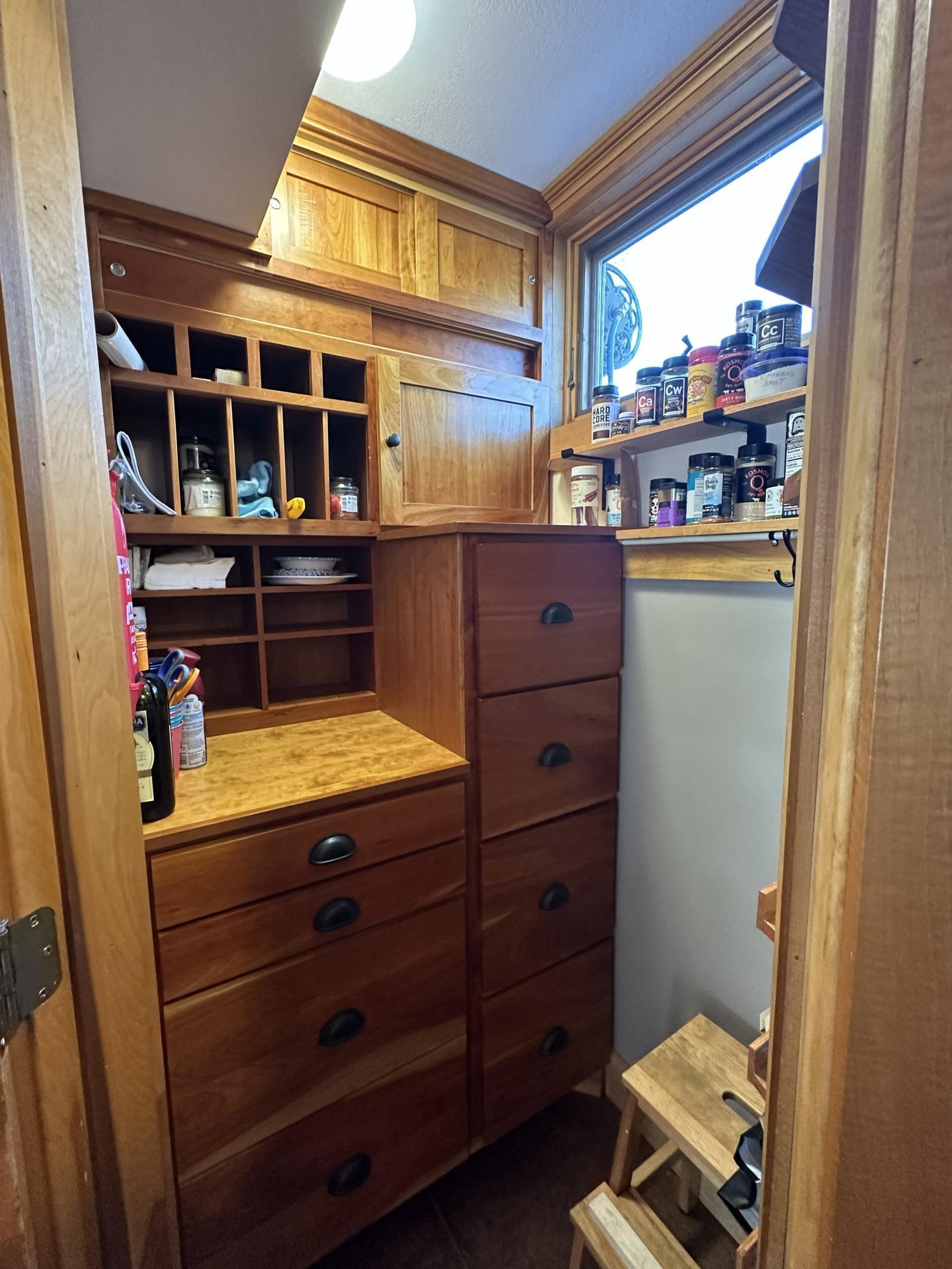 Built in corner pantry with plenty of storage for goods.