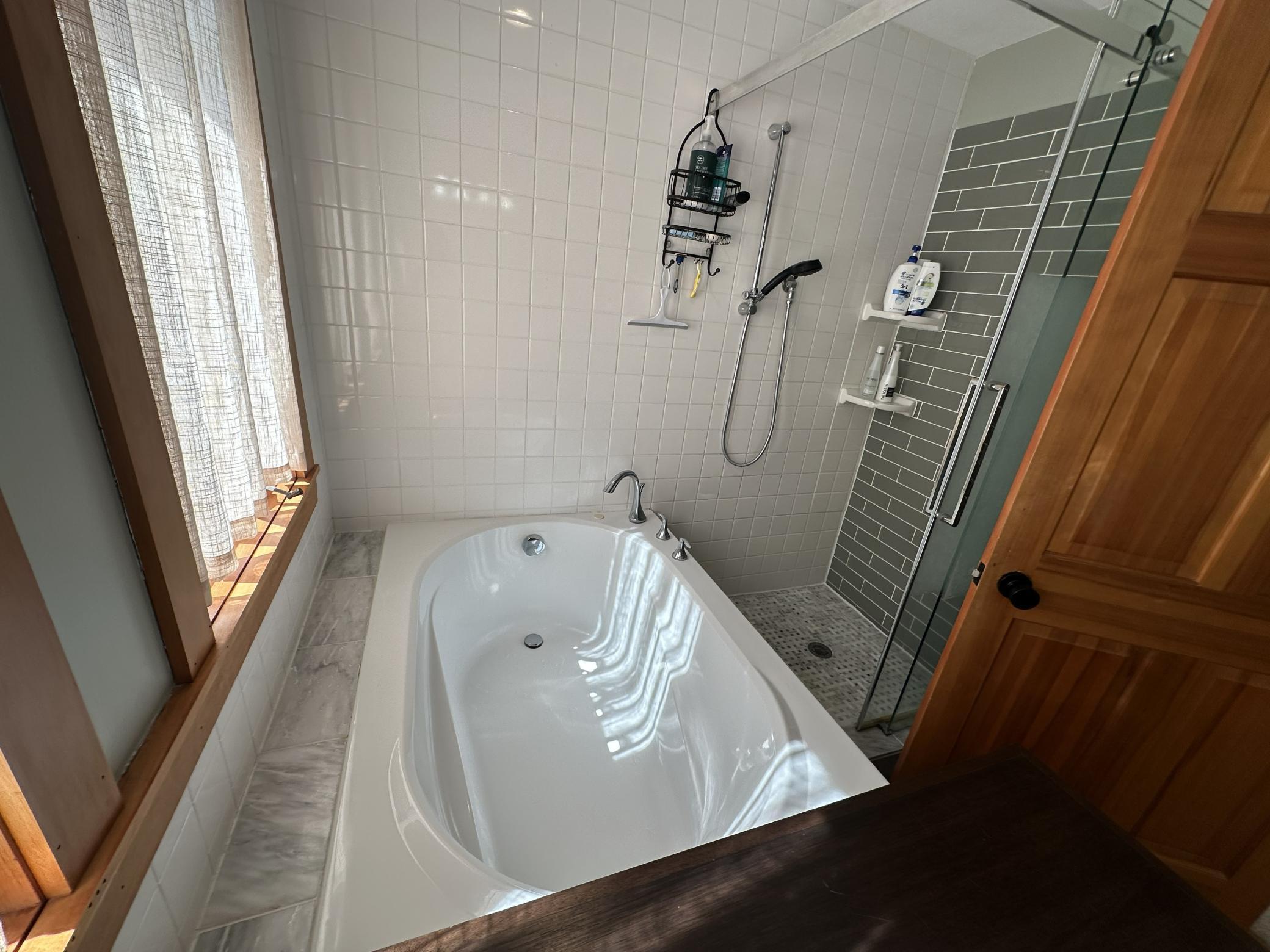 Upper level full bath with soaking tub and a good sized corner shower.