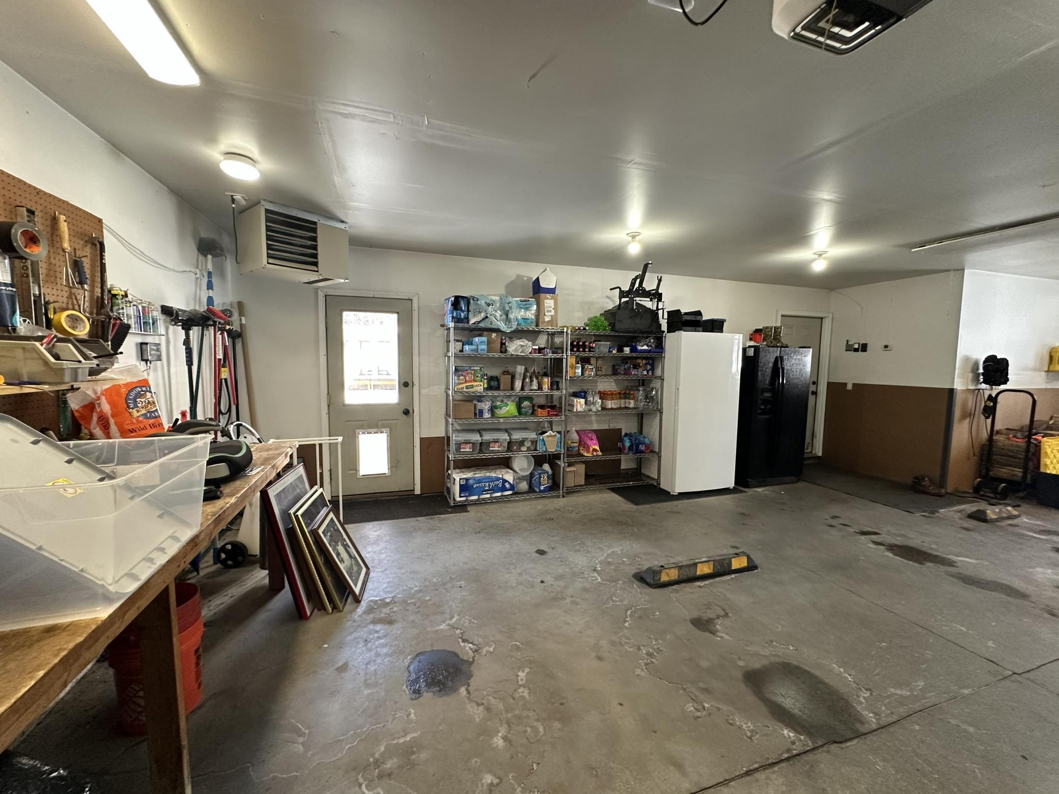 Attached heated 3 car garage with planting of lighting and electrical outlets.