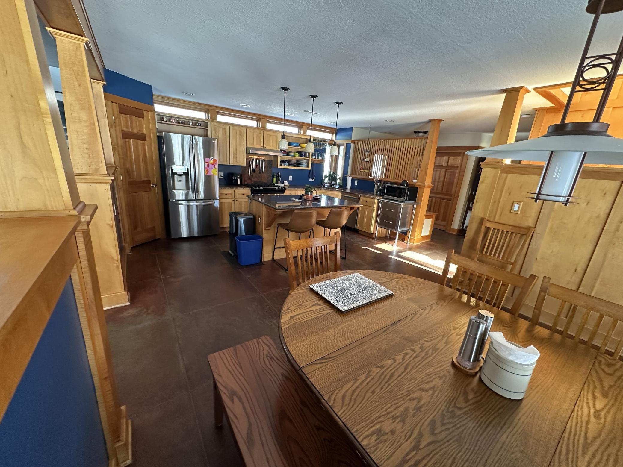 Wide open kitchen and dining room layout, has tons of natural lighting.