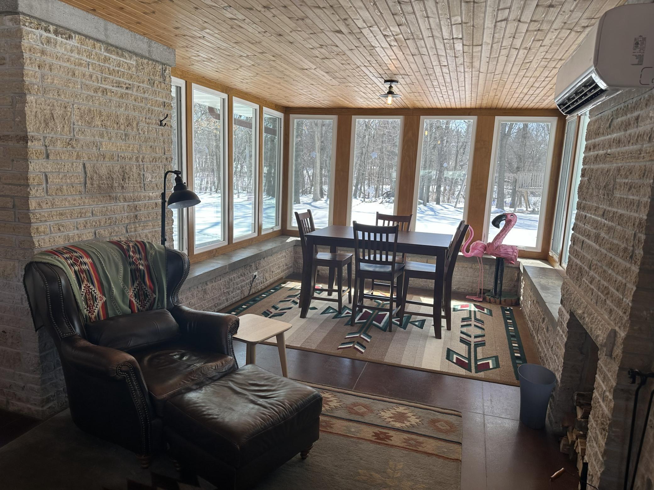 4 Season porch with new windows and new split package unit.