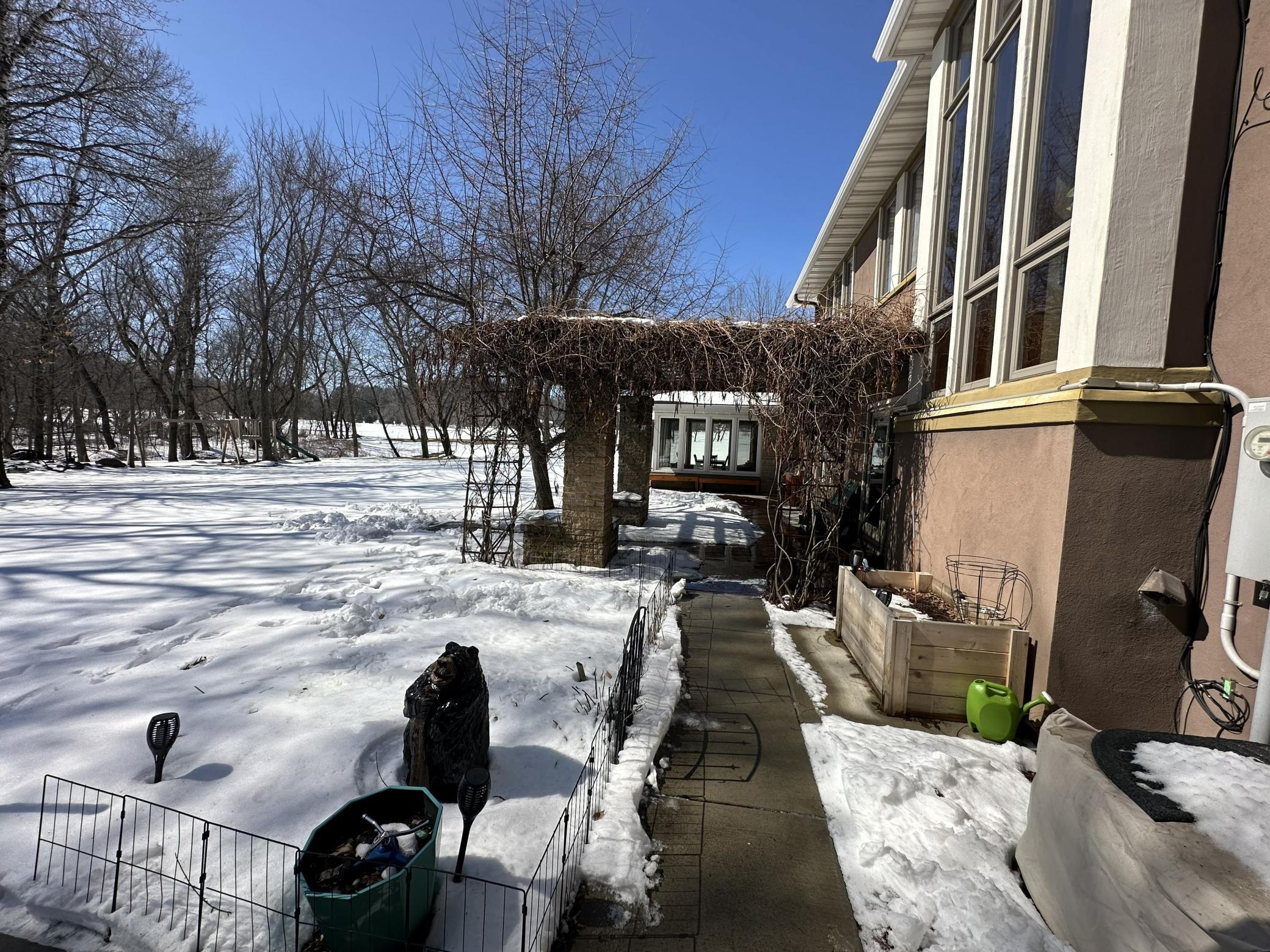 Outdoor pergola with a nice stamped colored concrete area for plenty of seating.