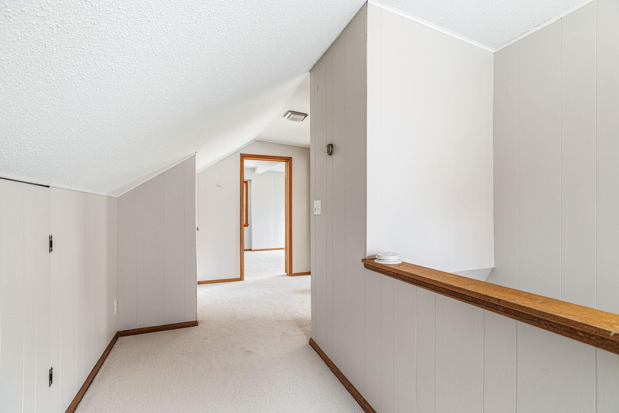 Upper level features two additional bedrooms, great storage space, and new carpet throughout.