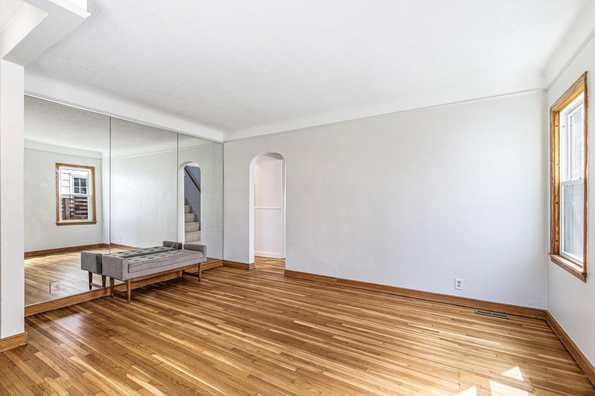 Gleaming newly refinished hardwood floors throughout the main level of the home.