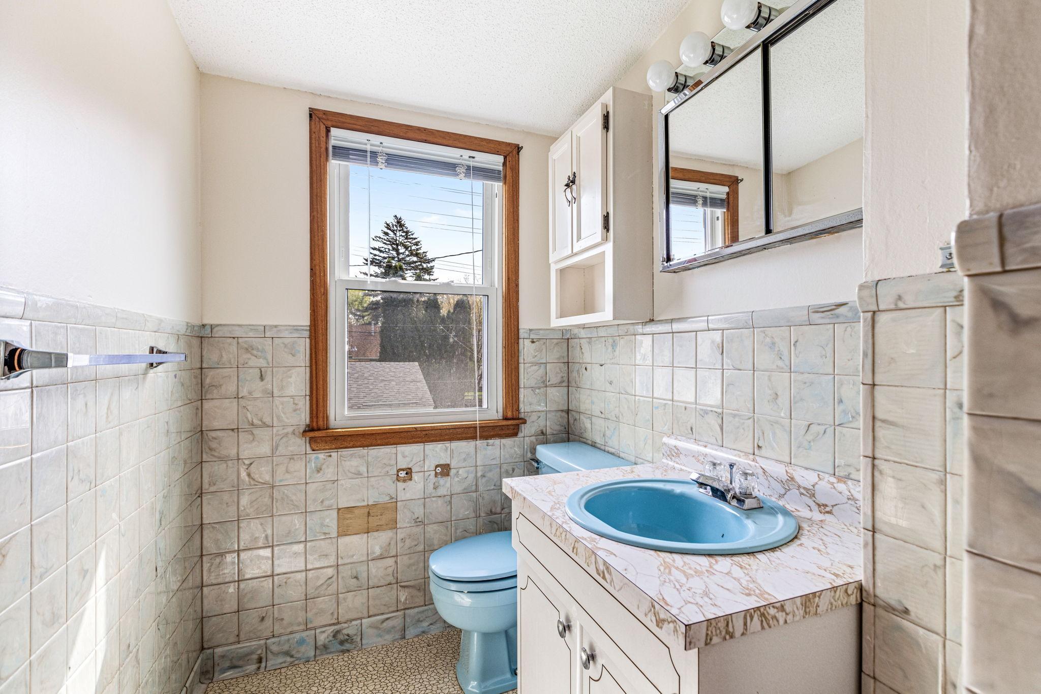 Convenient upper level half bathroom.