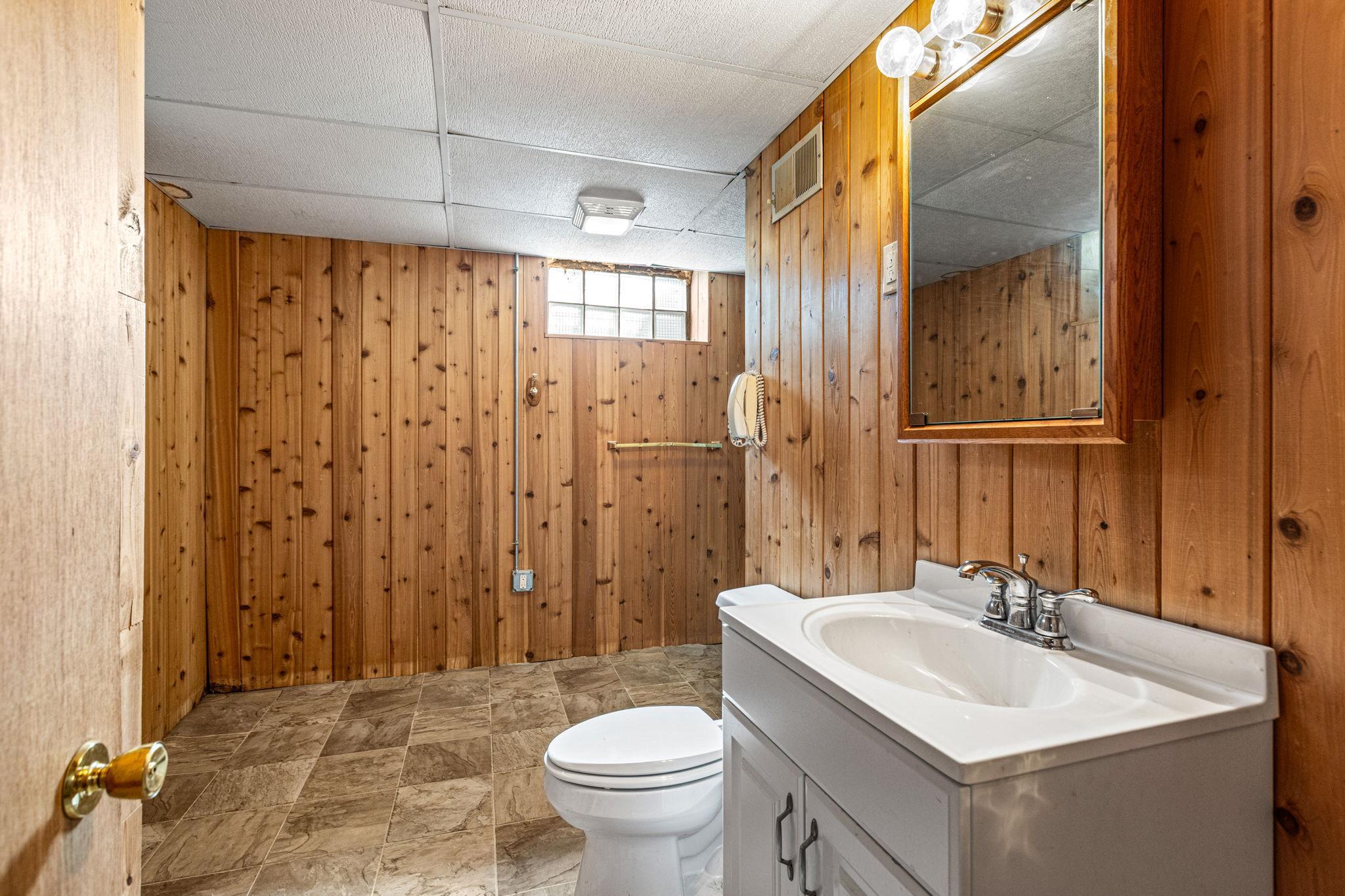 The lower level bathroom is so large you can fit a sauna in the corner!
