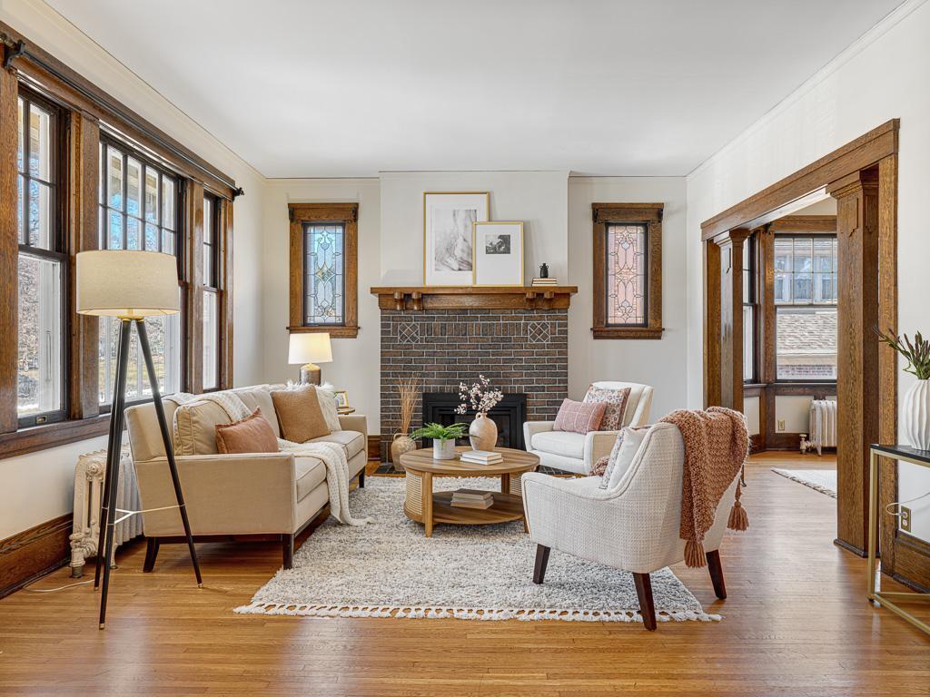 4 - Classy living room with beautiful woodwork, leaded windows and gas firplace.