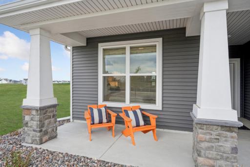 (Photo of a model home, actual finishes may vary) This home invites you in with a welcoming front porch.