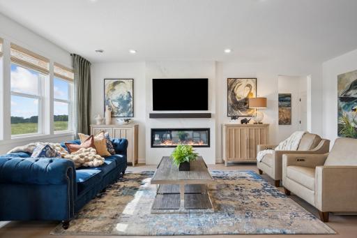 (Photo of a model home, actual finishes may vary) The Great Room features a warming electric fireplace.