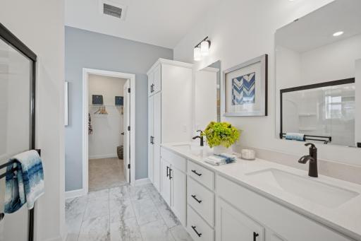 (Photo of a model home, actual finishes may vary) Adjacent to the owner's suite, this private bath is truly a retreat.