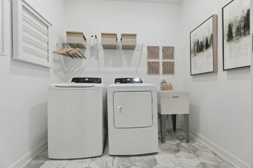 (Photo of a model home, actual finishes may vary) The laundry room.