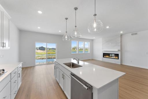 The kitchen overlooks the dining room for an easy transition between cooking and mealtime