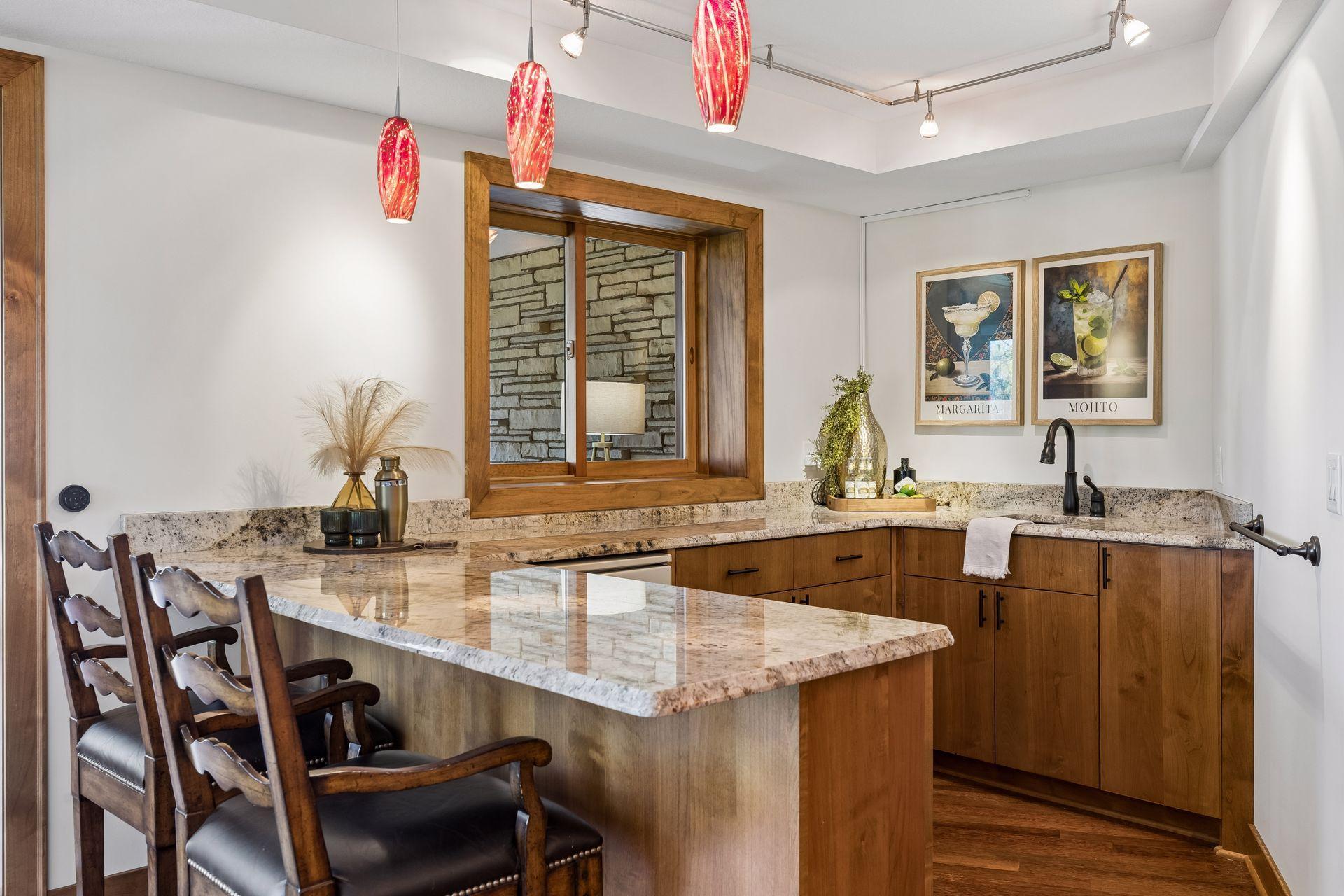 Wet Bar w/ Quartz Countertops and Warm-Toned Wood Finishes