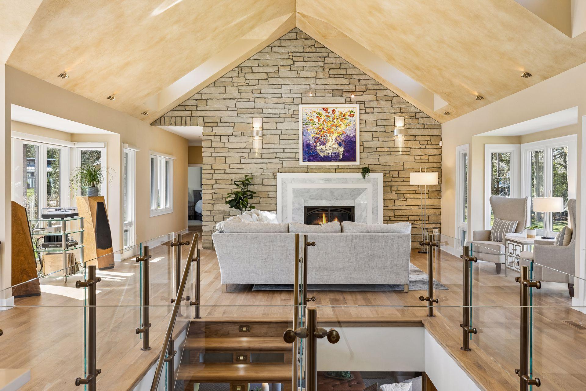 Black Walnut Hardwoods, Full Stone/Marble Fireplace Highlight the Living Room