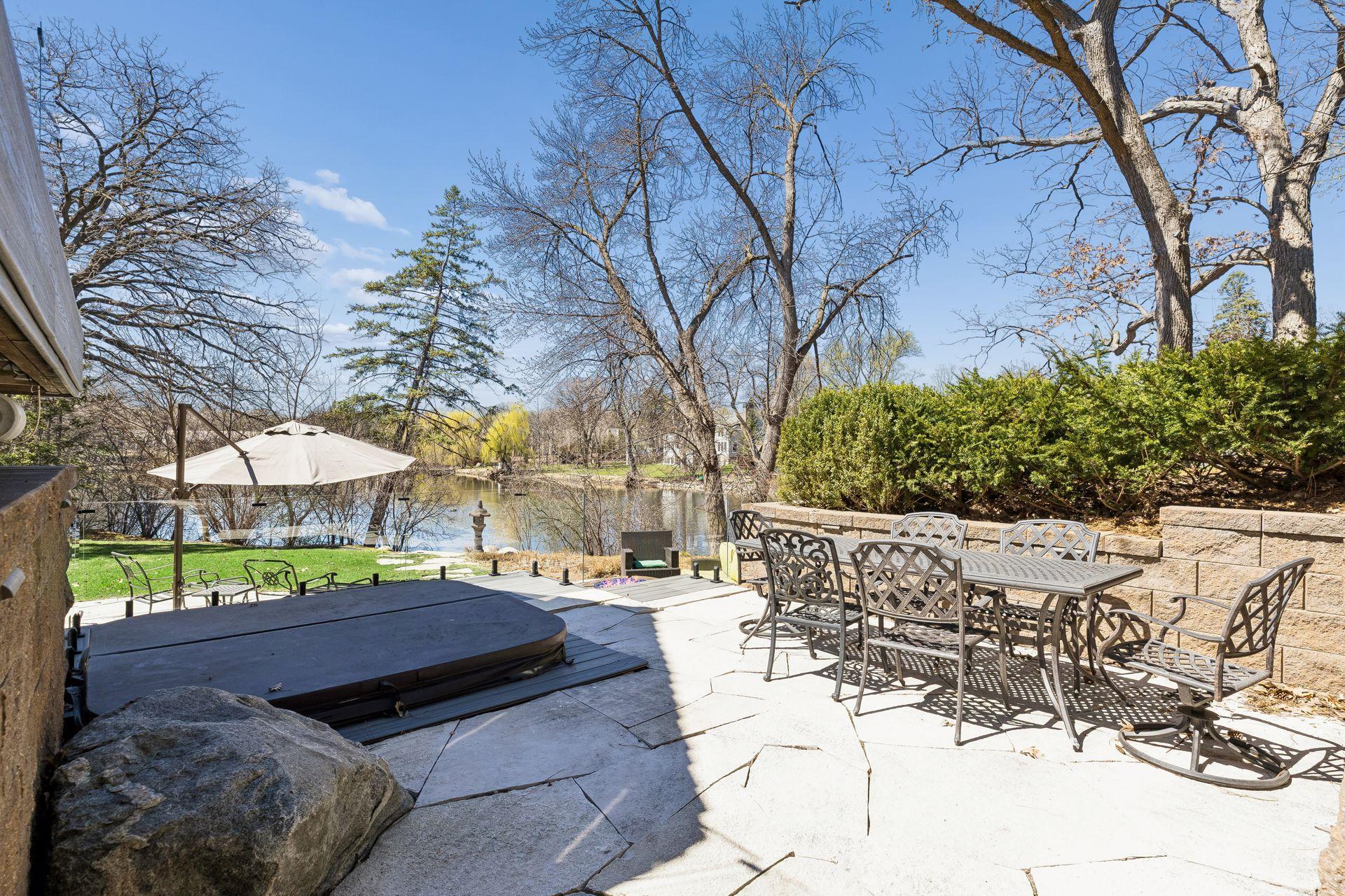Second Tier Features the Hot Tub, Stone Pavers & Outdoor Dining Area