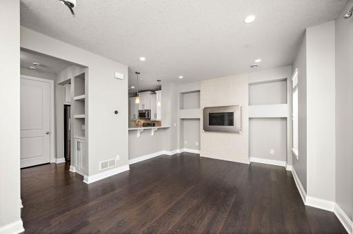 Wonderful main floor living room and dining area with seats up to the eat-in kitchen