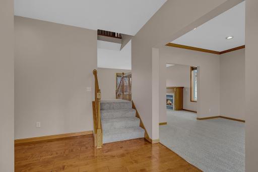 Two-sided staircase here in the foyer area and in the dining room for easy access to the upper level.