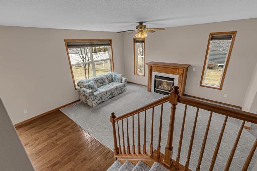 View from staircase landing into dining room and living room.