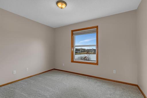 Zoned heating with an upstairs thermostat helps maintain comfort throughout the level.