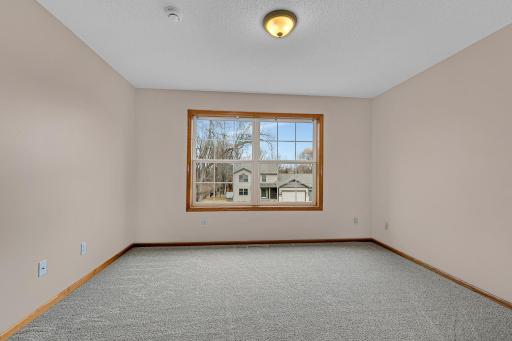 Fourth bedroom located on the upper level that offers a walk-in closet.