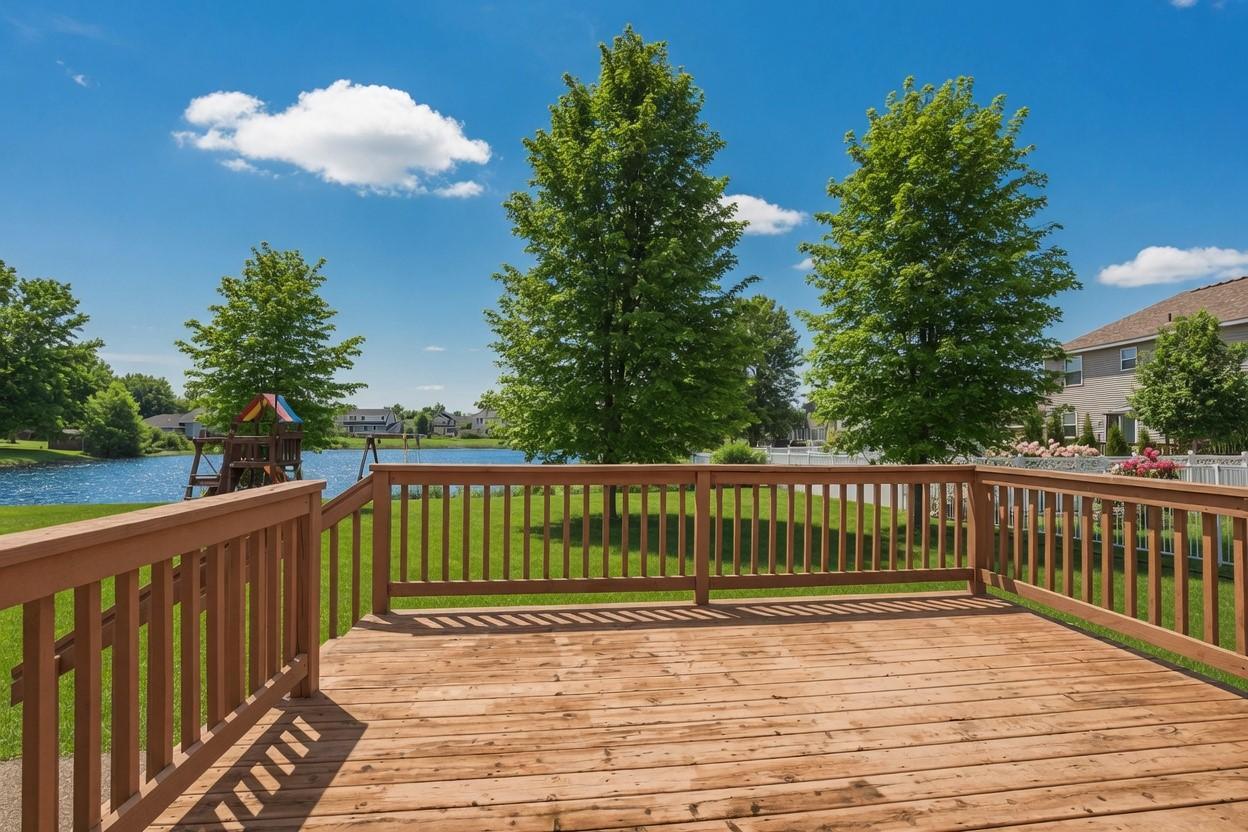 Spacious deck and an exposed aggregate concrete patio overlook the backyard and its peaceful pond setting—perfect for relaxing evenings or entertaining guests.