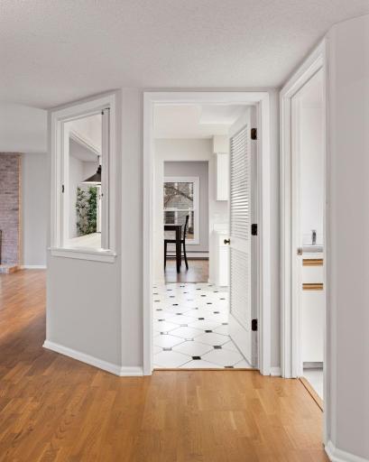 View toward the kitchen and hallway showing the functional layout and open flow.