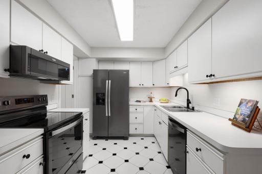 Clean, functional kitchen with abundant cabinet storage, ample counter space, and updated appliances.