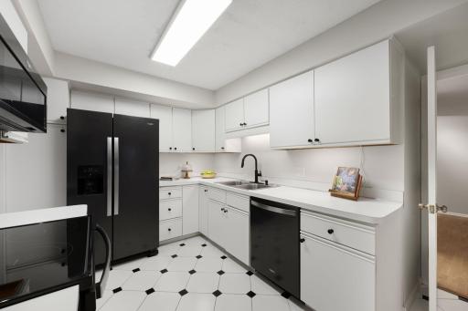 Kitchen showcasing abundant cabinetry and efficient layout.