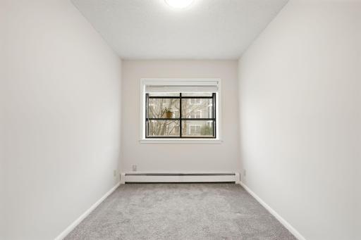 Versatile flex room with window and closet potential for office, hobby, or guest use.