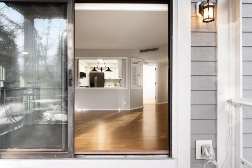 View from the screened porch back into the main living space and kitchen.