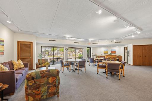 Spacious community room with seating areas for gatherings and events.