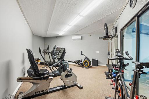 Community fitness room with a variety of exercise equipment.