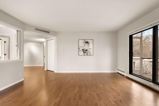 Living room showcasing natural light and flexible furniture layout options.
