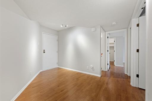 Welcoming entry area with hardwood floors and easy flow into the main living spaces.