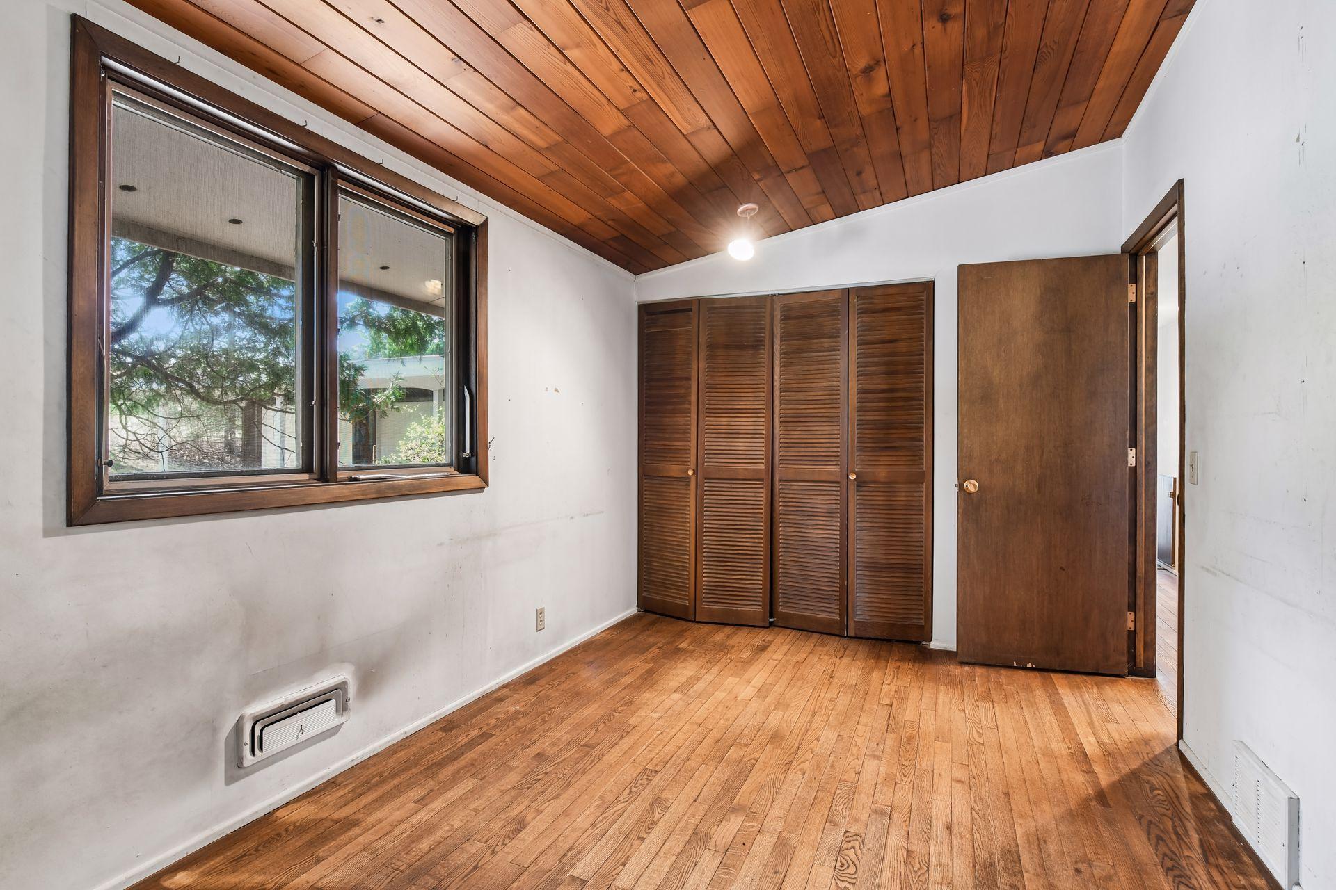 All three bedrooms have hardwood floors and vaulted ceilings.