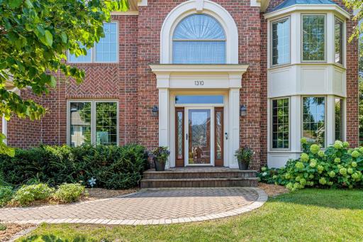 A closer look at the grand front entry and distinctive architectural details that give this home timeless appeal.