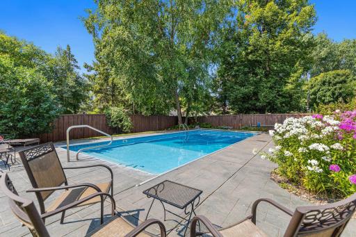 Welcome to “Club Med” on Woodcrest Ave! A sparkling inground pool and expansive surrounding patio set the stage for summer fun.