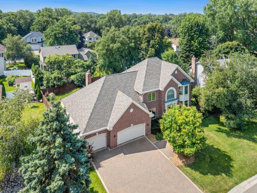 A beautiful perspective of this impressive Royal Oak Estates West home and its mature, tree-lined setting.