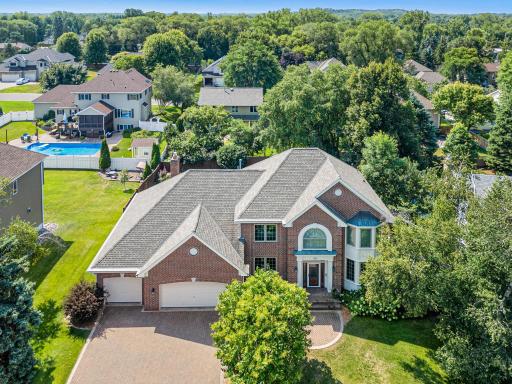 Classic architecture, brick detailing and mature surroundings give this Woodcrest Ave home standout curb appeal.