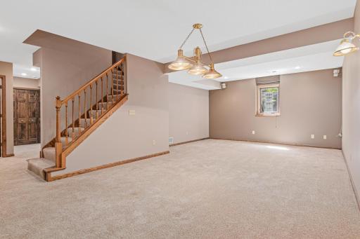 The lower-level recreation room offers another fantastic space for relaxing, entertaining, and making memories.