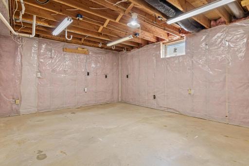 Additional unfinished space offers excellent potential for future expansion or customized living space. Bring your ideas and create an area perfectly suited to your needs.