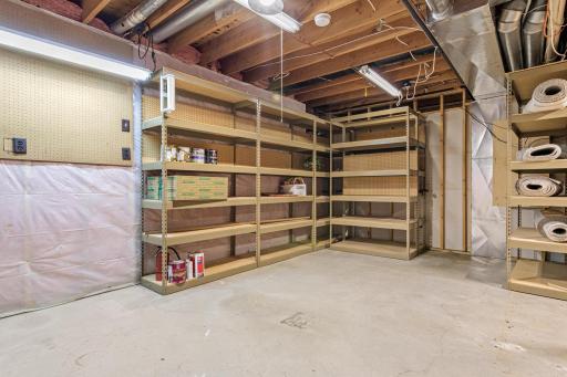 The lower-level workshop provides a dedicated space for projects, hobbies, crafts, or additional storage. A great bonus for anyone looking for functional workspace within the home.