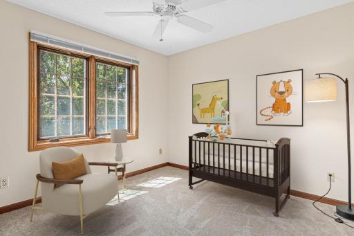 One of three additional upper-level bedrooms offer comfortable accommodations with plenty of flexibility for family, guests, or hobbies. Fresh 2026 carpet adds a clean, updated feel throughout the upper level. Virtually staged.