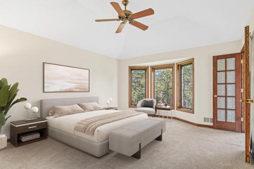 The spacious primary bedroom provides a peaceful retreat at the end of the day. Fresh 2026 carpet and a comfortable layout create a relaxing space to unwind. Virtually staged.