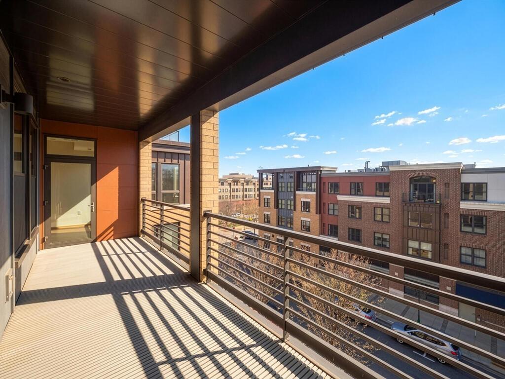 The expansive deck offers access from both the dining area and the primary bedroom.