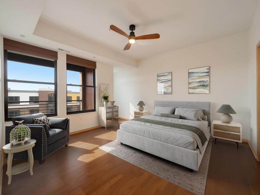 The spacious primary bedroom comfortably accommodates a king-size bed and essential furniture. It boasts a generous walk-in closet and an ensuite bathroom with separate dual sinks, a walk-in shower, and a soaking tub.(Photo has been virtually staged)