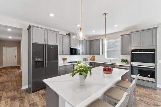 Welcome home to our Dover II Floorplan! Single level living has the perfect balance of open concept with defined spaces for your kitchen, dining and living room needs. *Picture is of model home; actual finishes may vary.