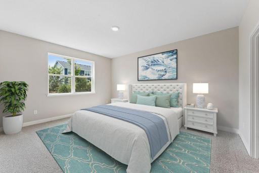 Primary bedroom suite with large window allows for a quiet retreat from the rest of the home. *Picture is of mode home; actual finishes may vary.